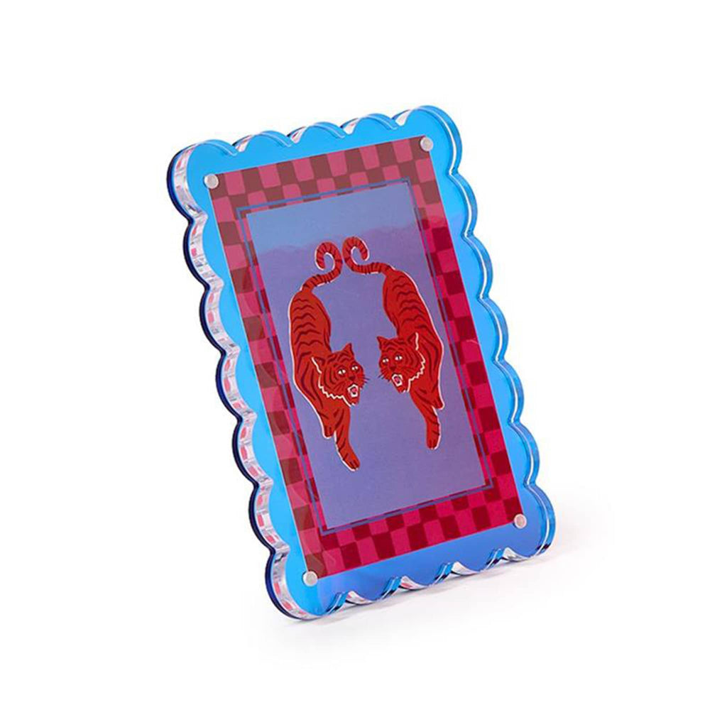 Blue acrylic frame with checkered border and orange tiger design, angle view, on a white background.