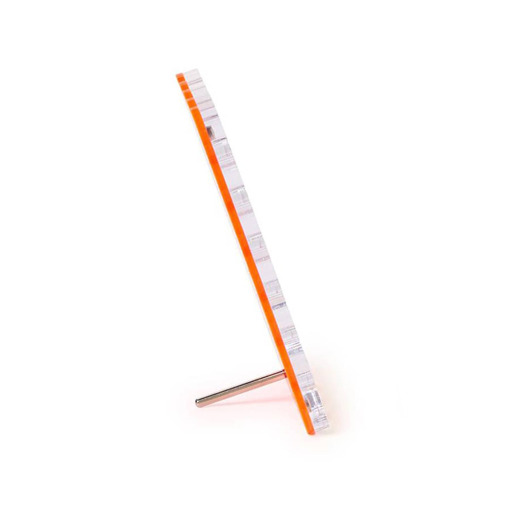 Pink acrylic frame, side view, on a white background.