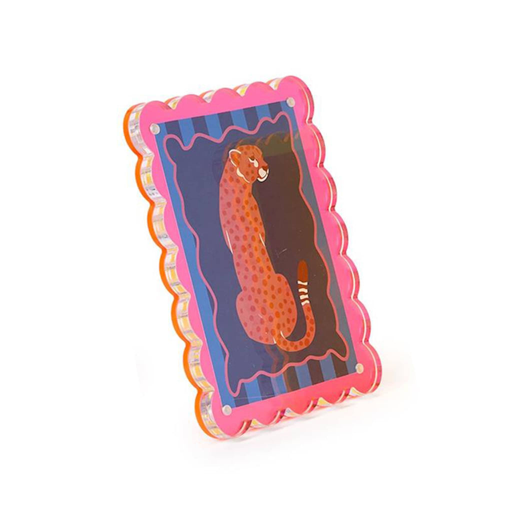 Pink acrylic frame with striped border and pink leopard design, angle view, on a white background.