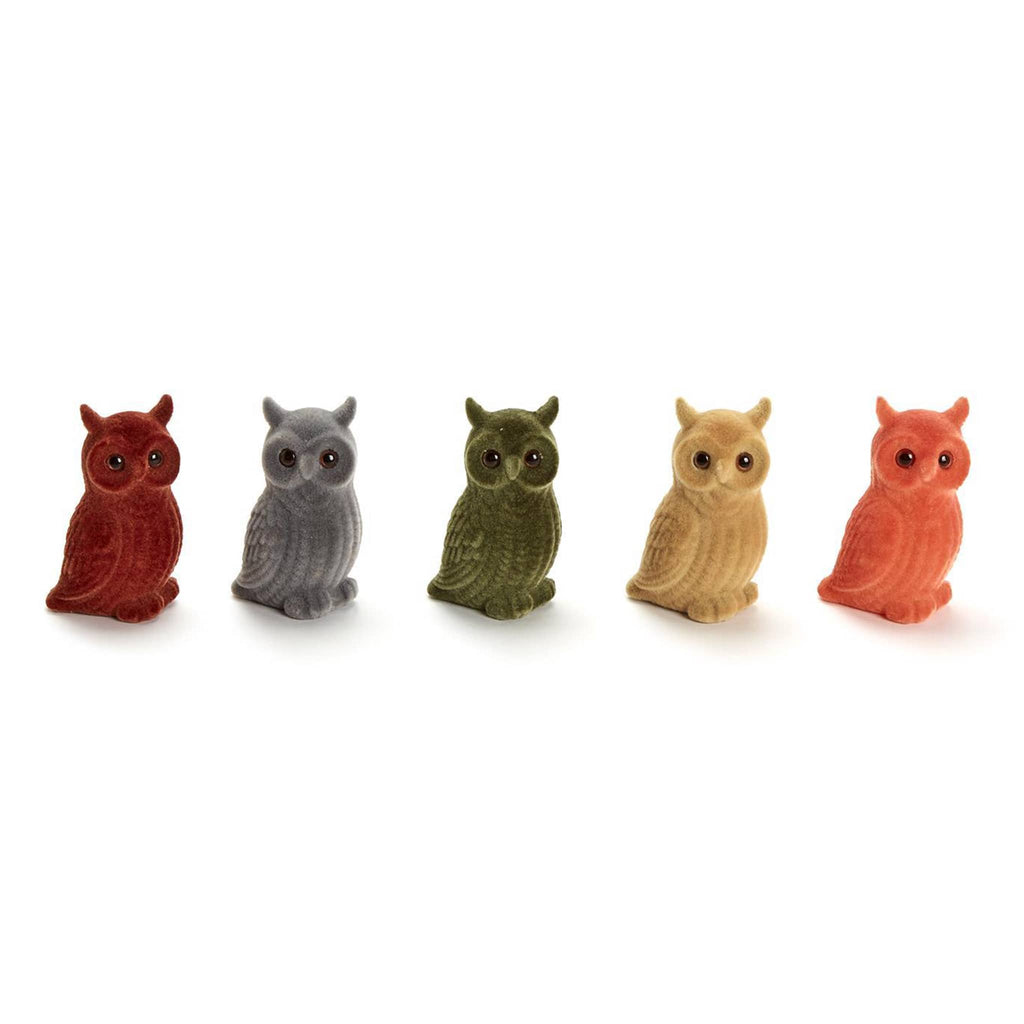 Five small flocked owl figurines in different autumn colors on a white background.
