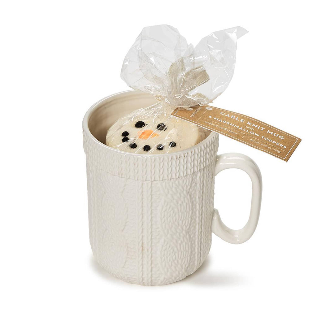 Two's Company white cable knit stoneware mug with vanilla flavored marshmallow hot cocoa toppers, in packaging.