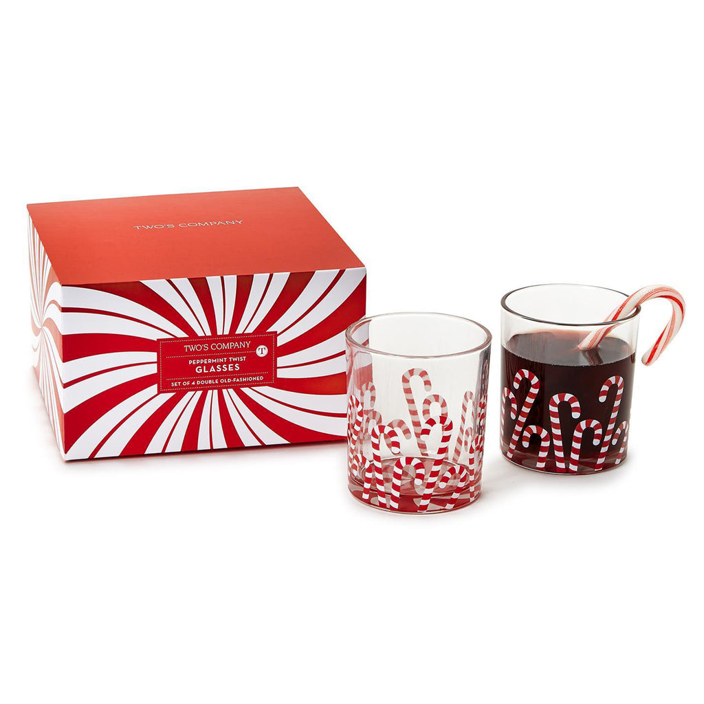 Two's Company Peppermint Twist double old fashioned glasses with candy cane design, 2 are shown, one with soda, beside the red and white striped gift box packaging.