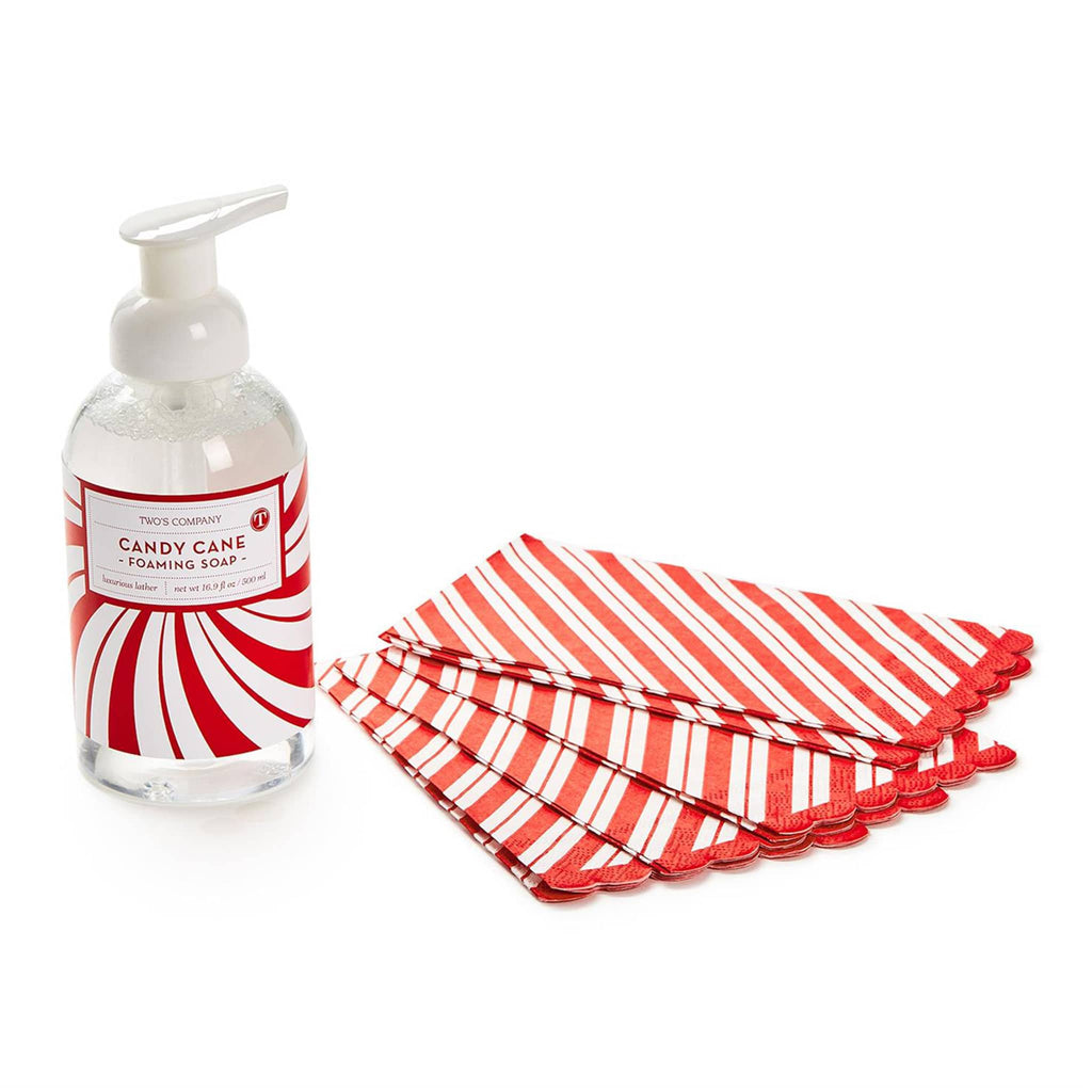 Two's Company Candy Cane peppermint scented foaming hand soap beside red and white striped paper guest towels.