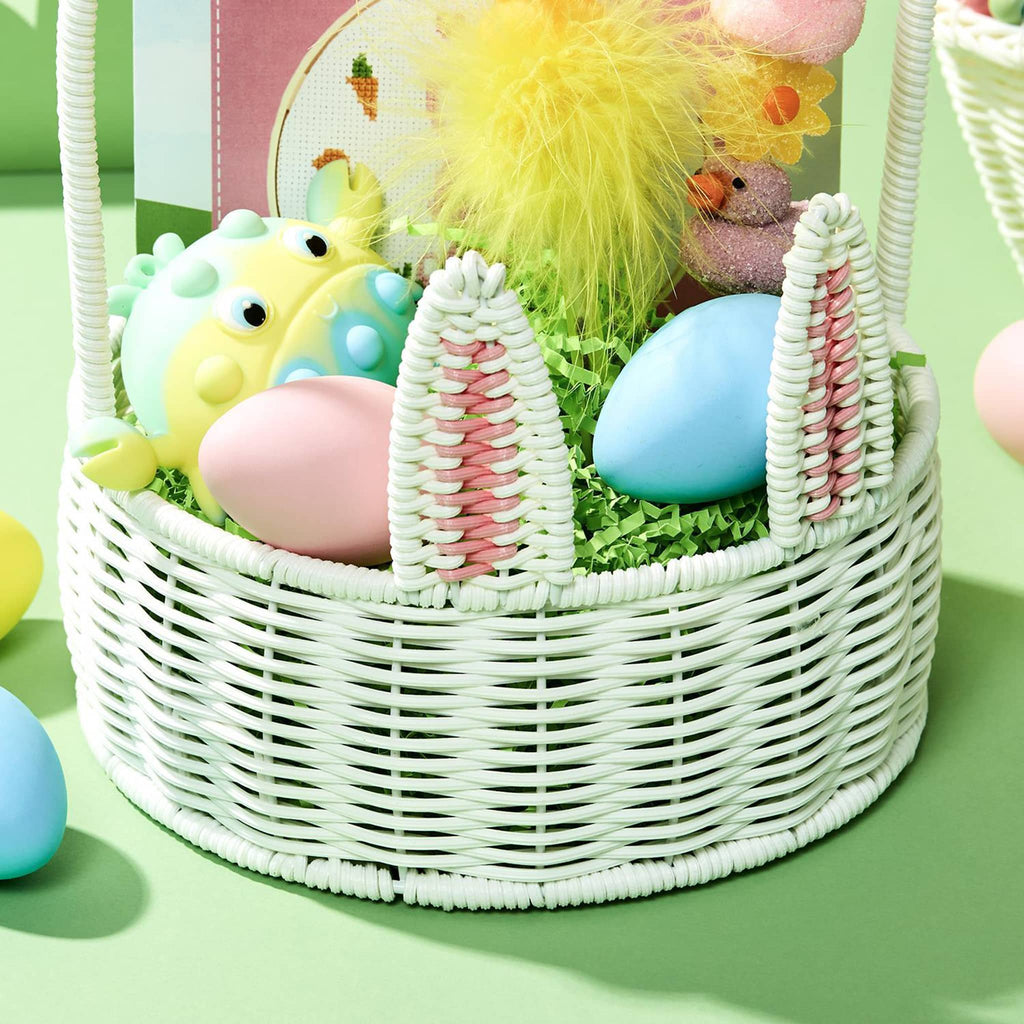 Two's Company large white faux wicker bunny basket with tall handle, detail, filled with colored eggs, candy and surprises.