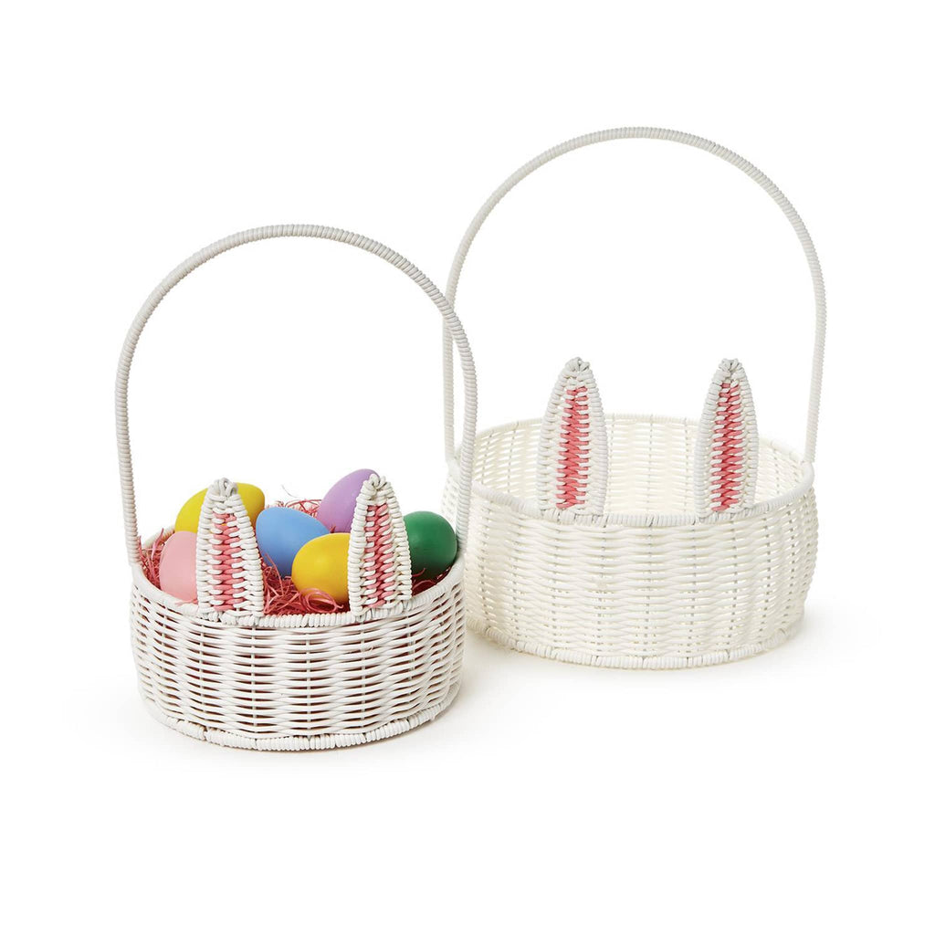 Two's Company small and large white faux wicker bunny baskets with tall handles, front view. Small basket has colorful eggs inside.