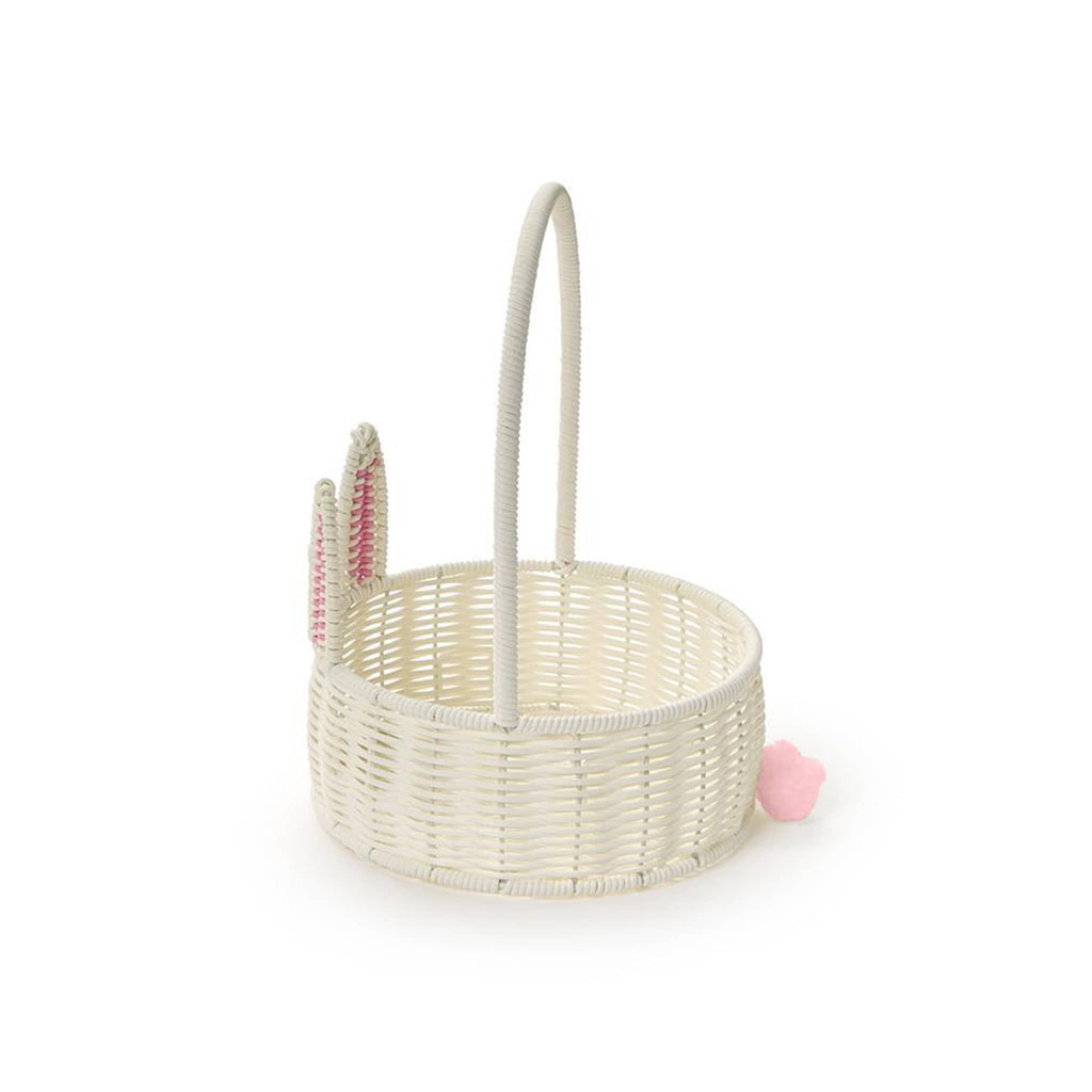 Two's Company small white faux wicker bunny basket with tall handle, side view.