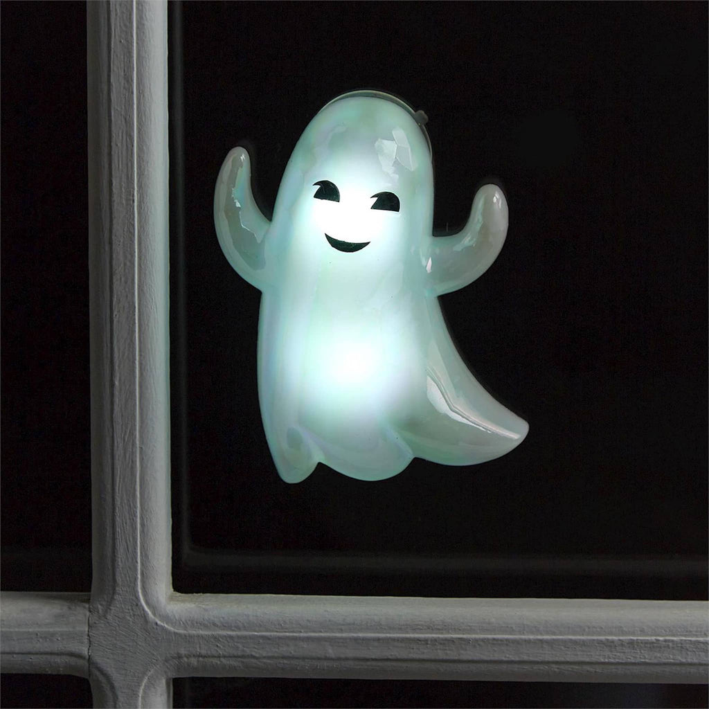 Ghost-shaped light on a black background.