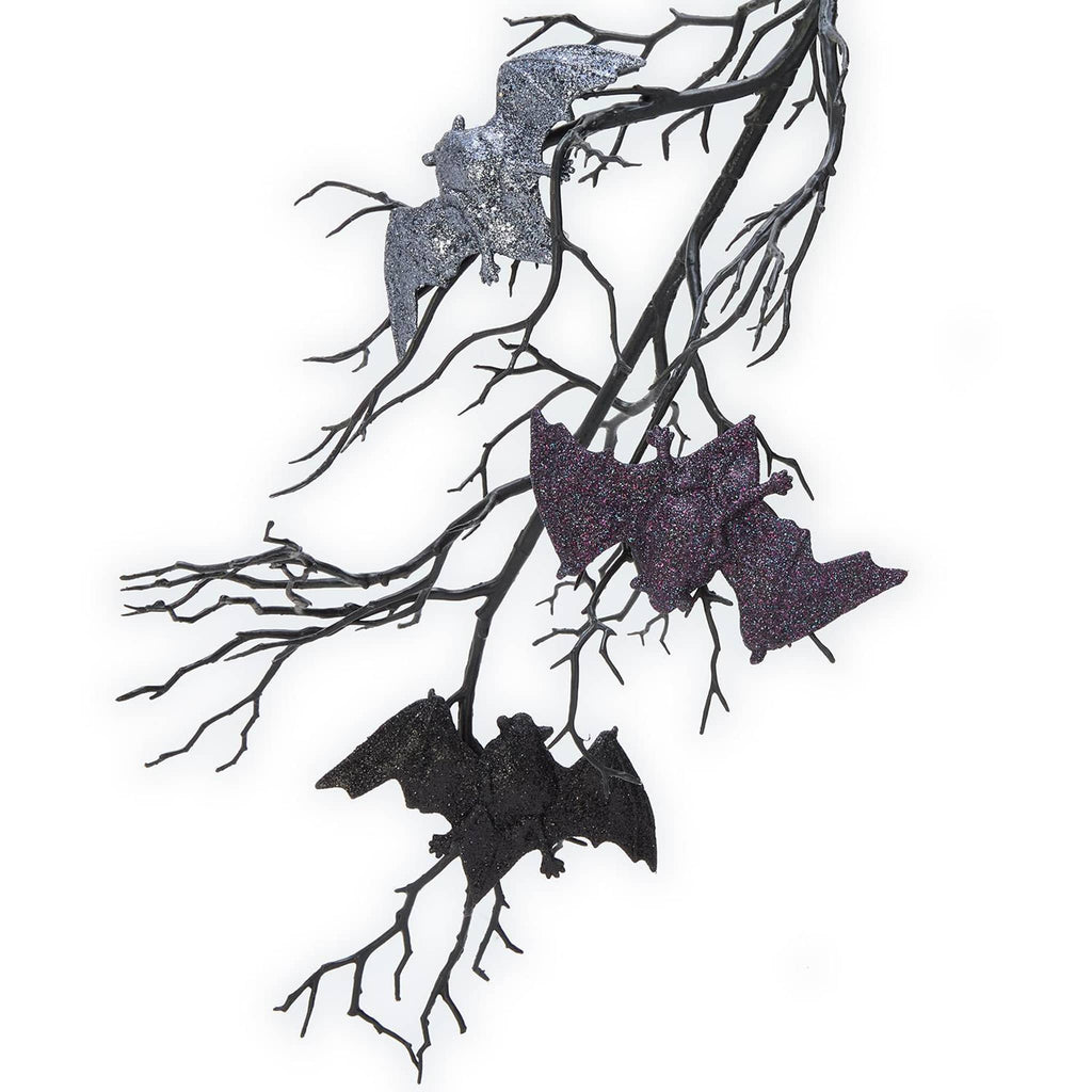 Decorative Halloween bats on branches with glittery texture on a white background.