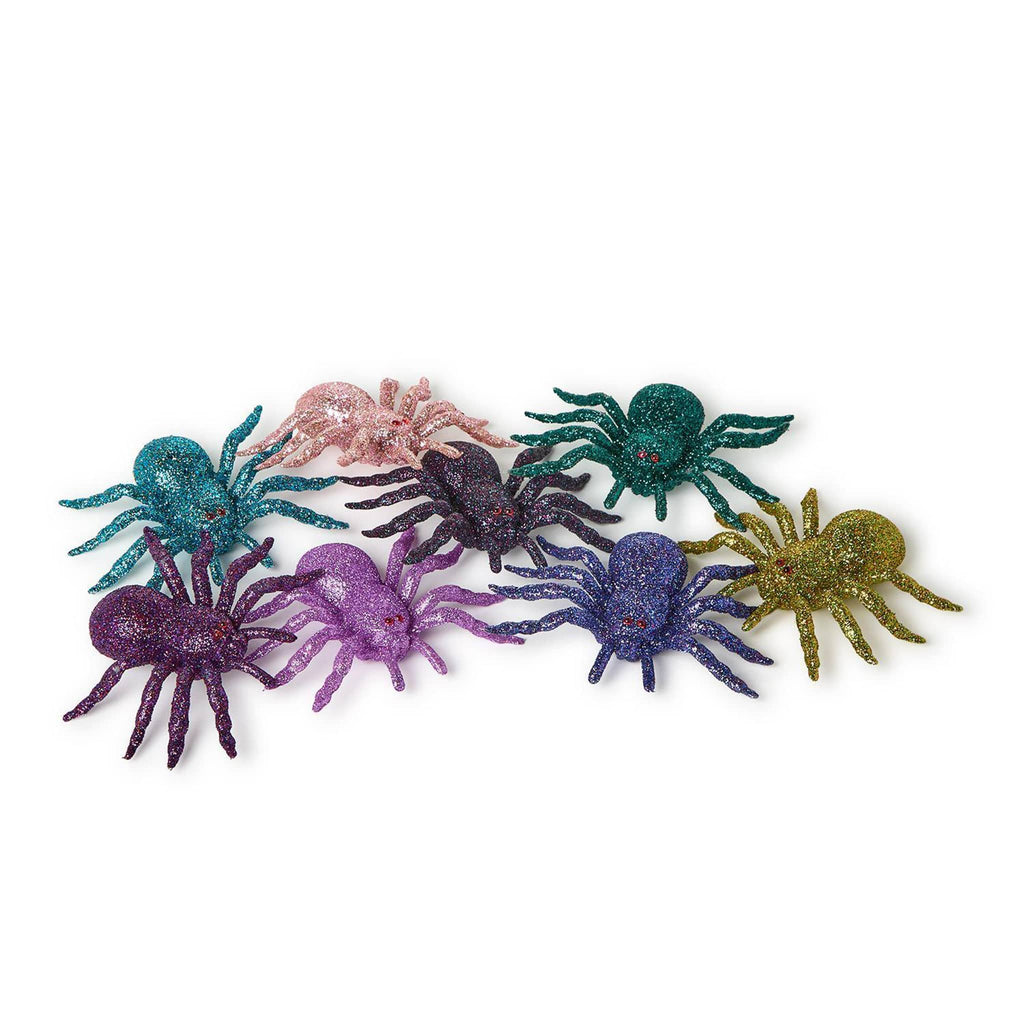 Colorful glittery spider decorations on a white background.