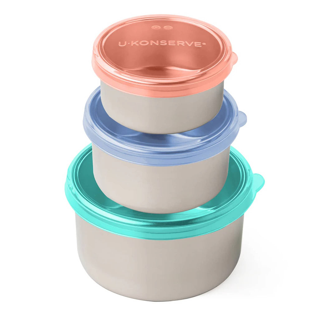 U-Konserve set of three round stainless steel food containers in 5 ounce, 9 ounce and 16 ounce capacity, each with a plastic-free, leakproof, silicone lid in orange, blue or turquoise, containers are stacked with smallest on top.