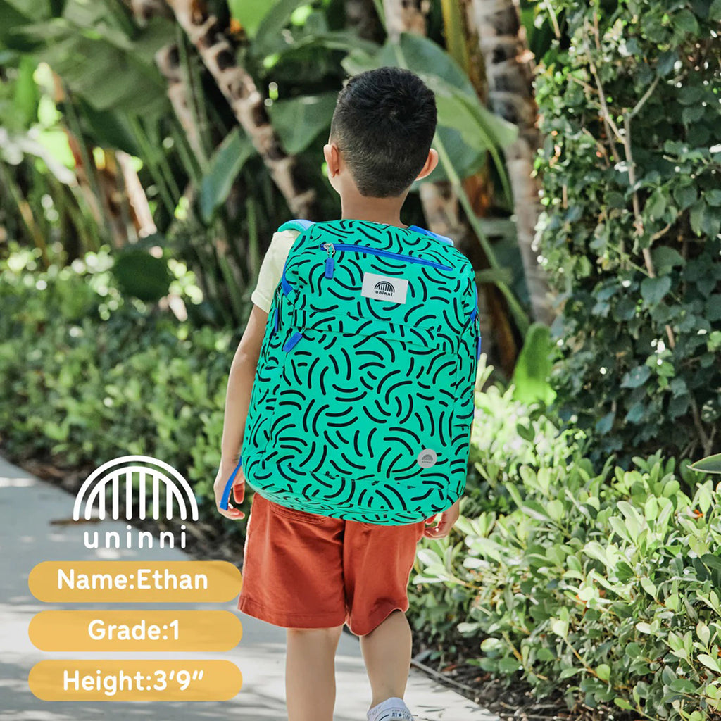 Uninni Brush Strokes Bailey Backpack on the back of a child.