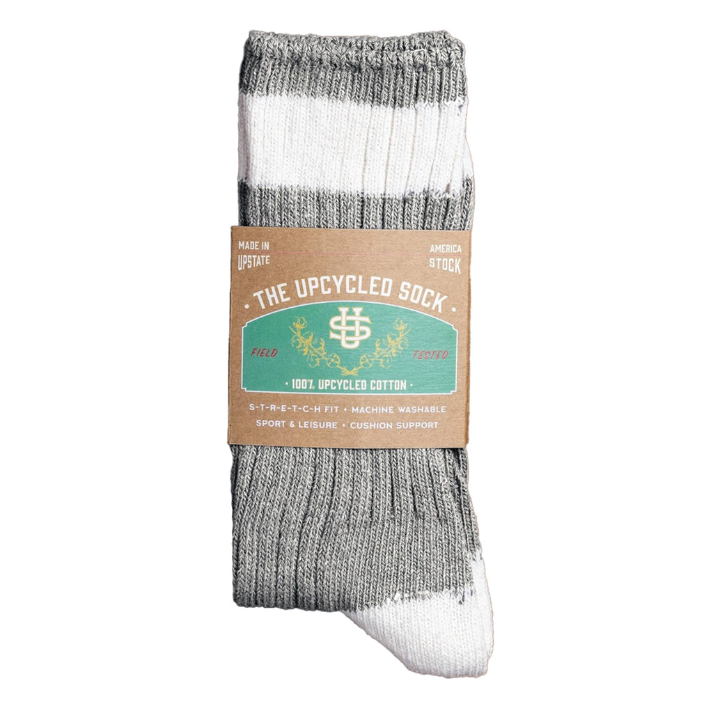 Gray and white sock with 'The Upcycled Sock' packaging on a white background.