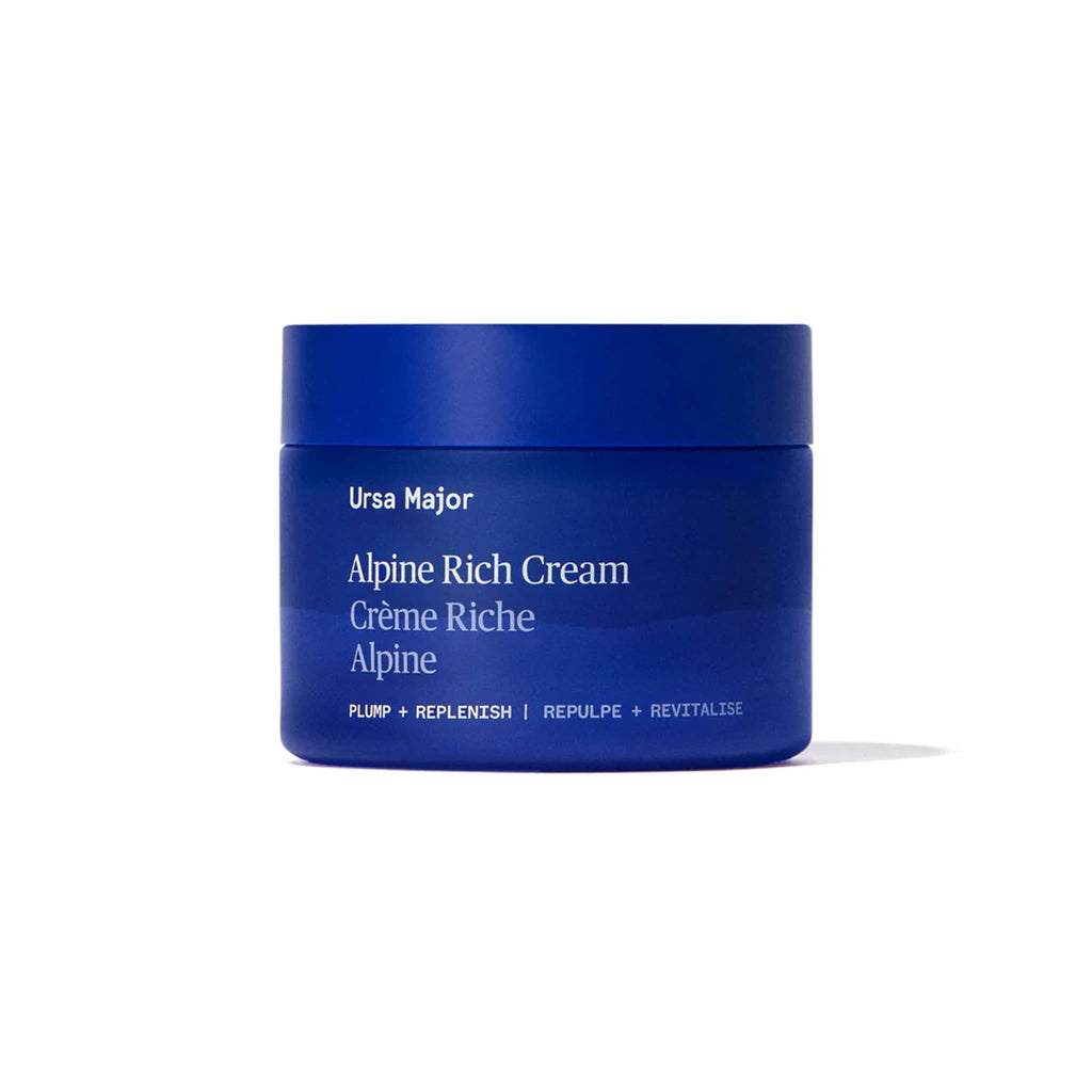 Blue jar of Ursa Major Alpine Rich Cream on a white background.