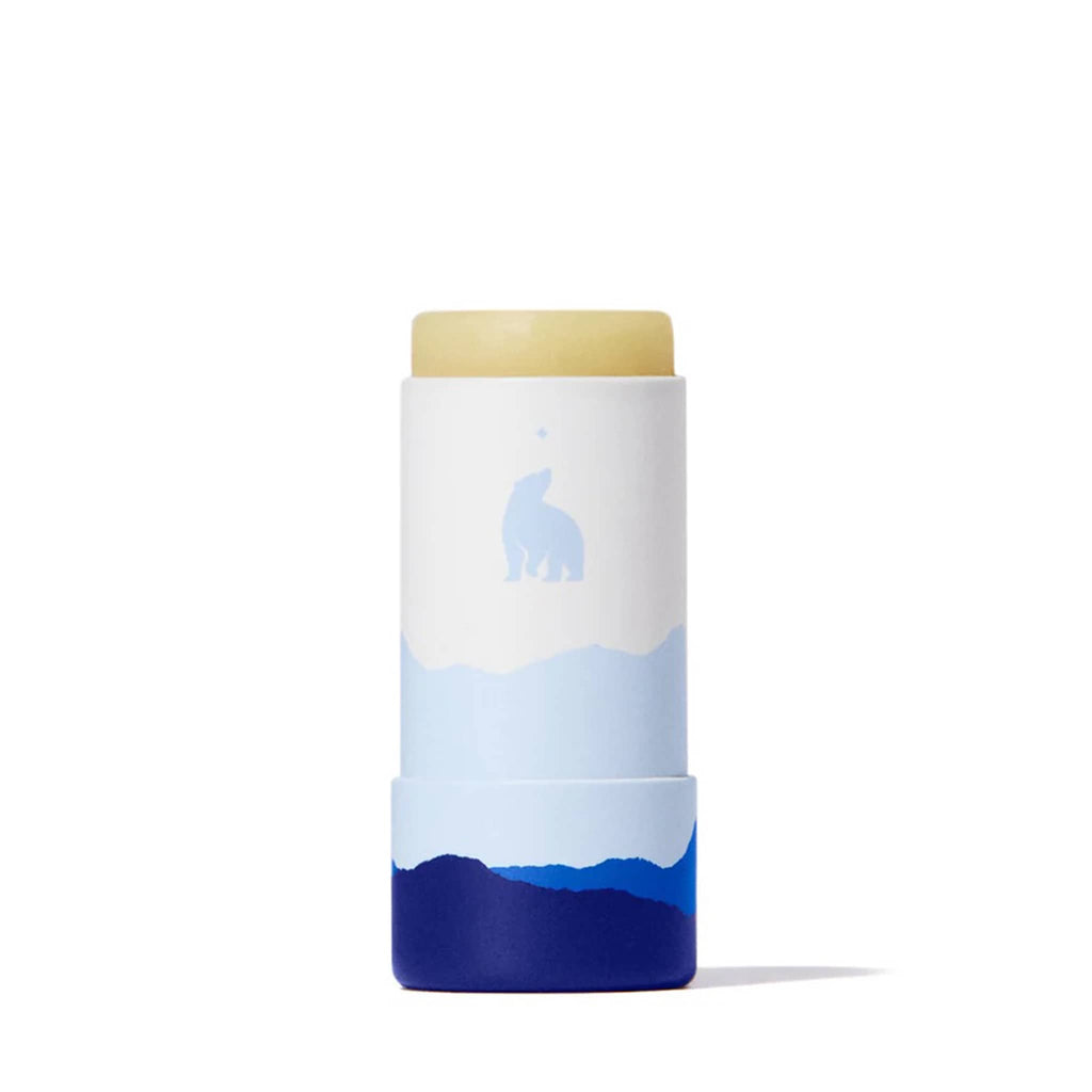 Lip balm stick in blue and white paper tube packaging with lid off, on a white background.