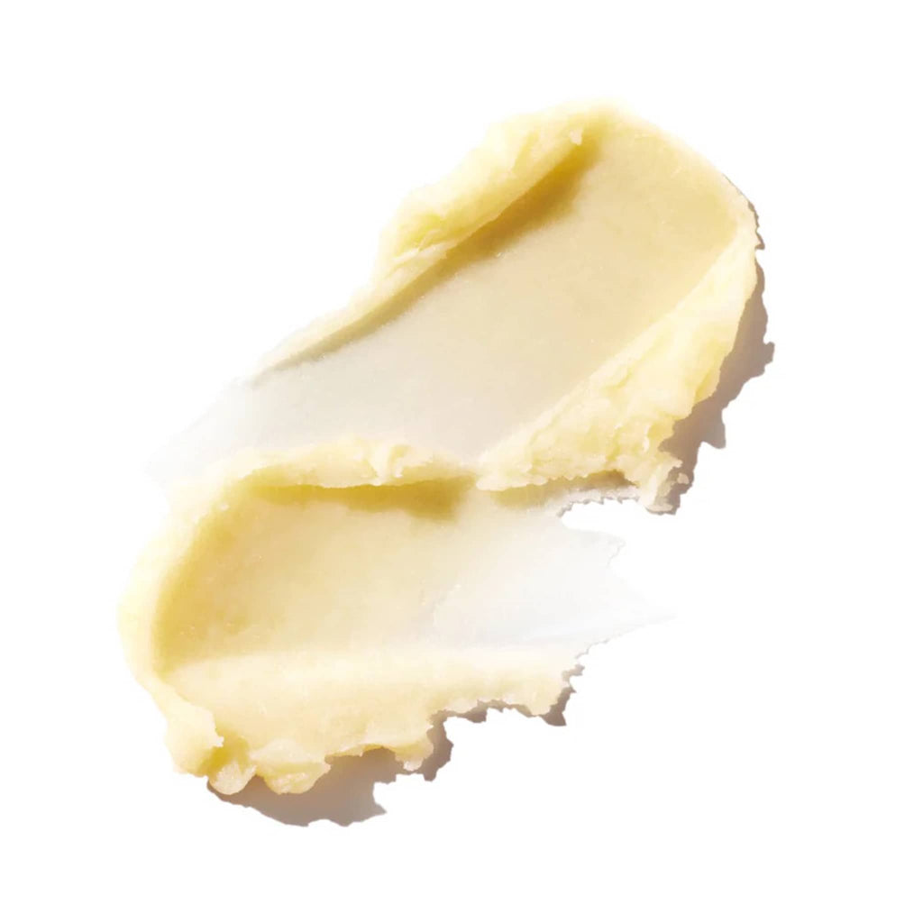 Close-up of a smear of lip balm on a white background.