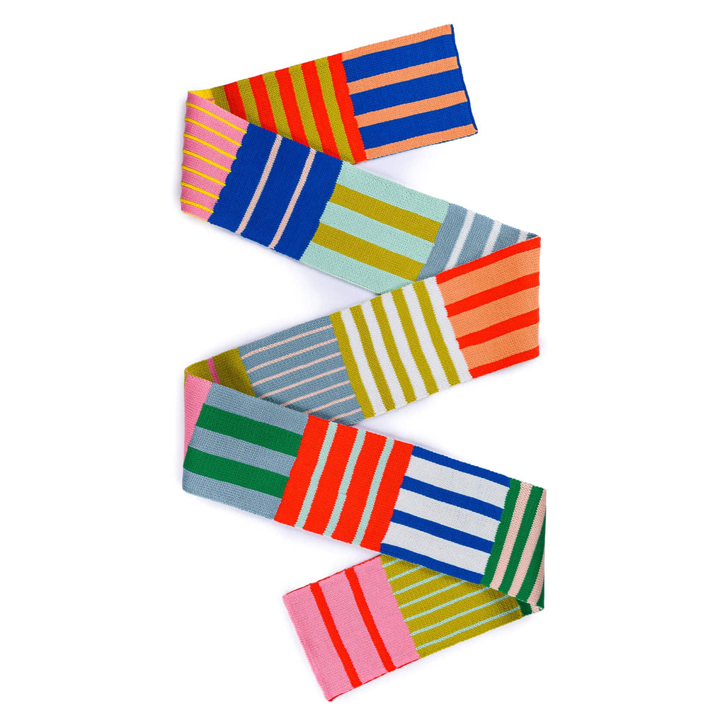 Verloop Patchwork Stripe Skinny Knit Scarf in rainbow colors folded in zig zag so you can see front and back.