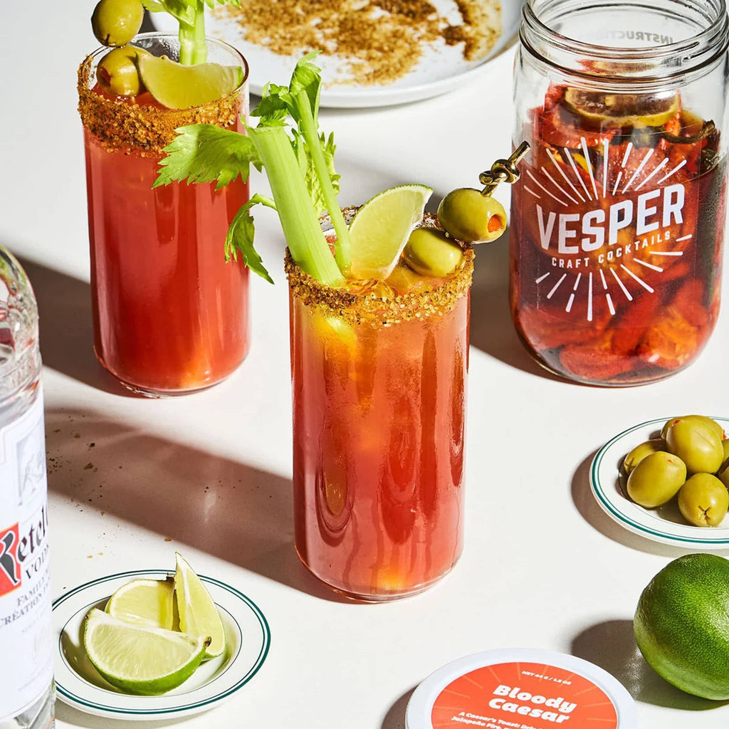 Vesper Cocktails Bloody Caesar Craft Cocktail Infusion Kit in mason jar with finished drinks with garnishes.