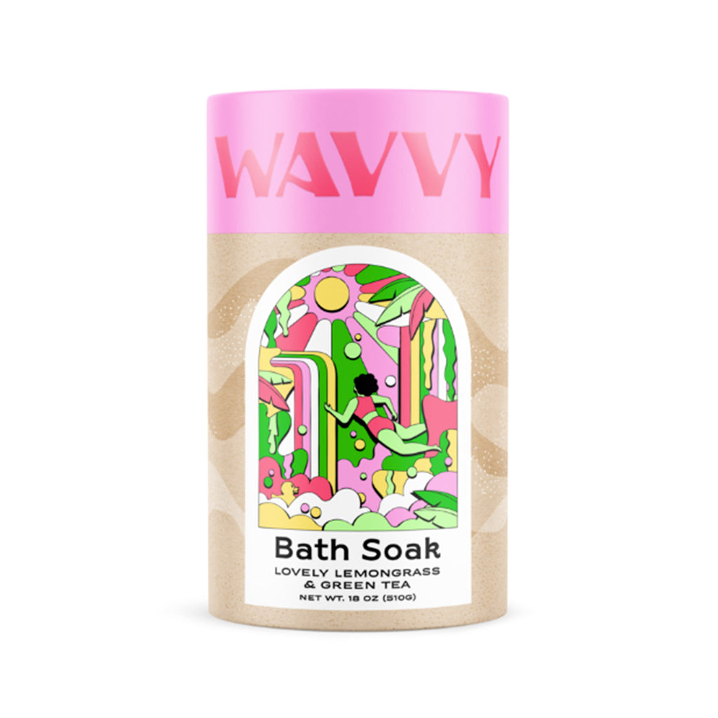 Wavvy Lovely Lemongrass and Green Tea Bath Soak in canister packaging with a colorful illustration and pink top with logo.