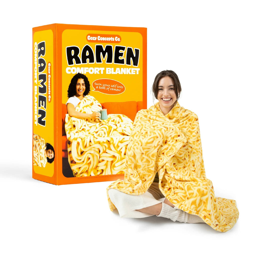 Person wearing a ramen noodle-themed comfort blanket with a box in the background.
