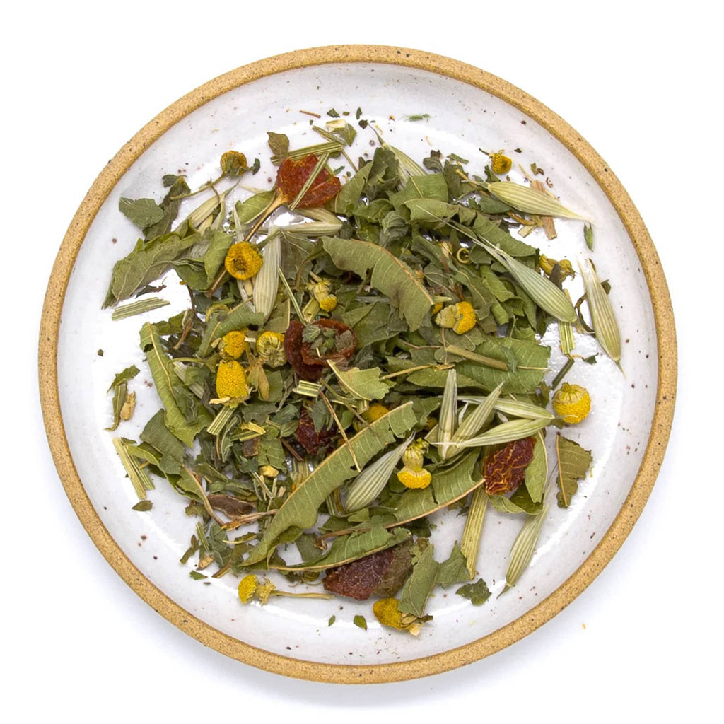 Wild & Tea Quiet Mind loose-leaf herbal tea spill on plate.