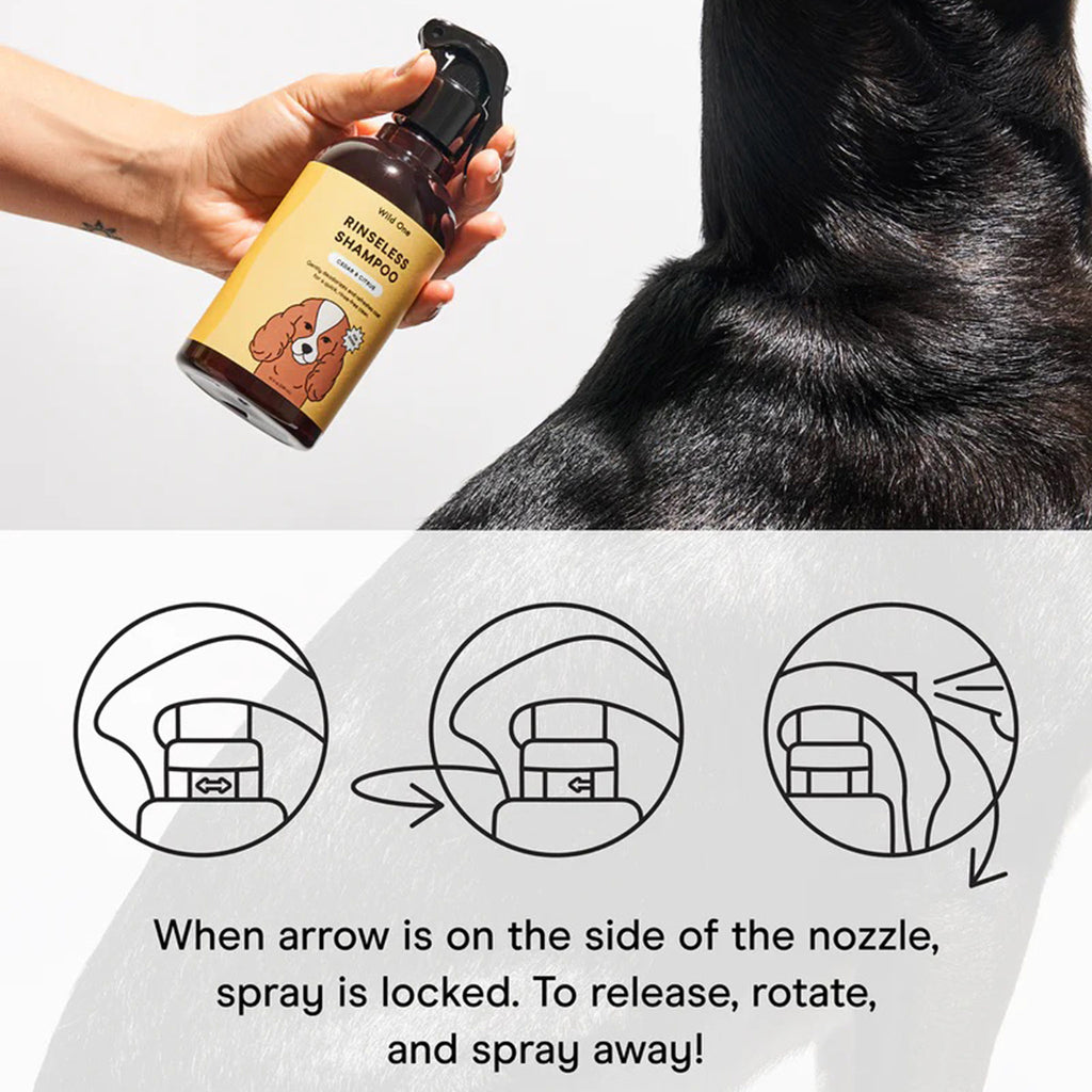 Wild One Cedar & Citrus scented rinseless shampoo for dogs in spray bottle with instructions on how to use nozzle.