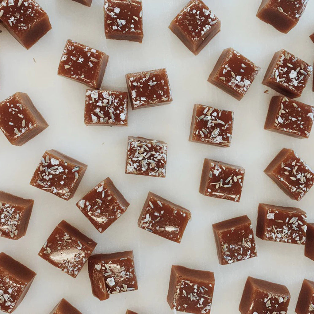 Wildflower Caramel Company Honey Lavender Caramels on white surface.