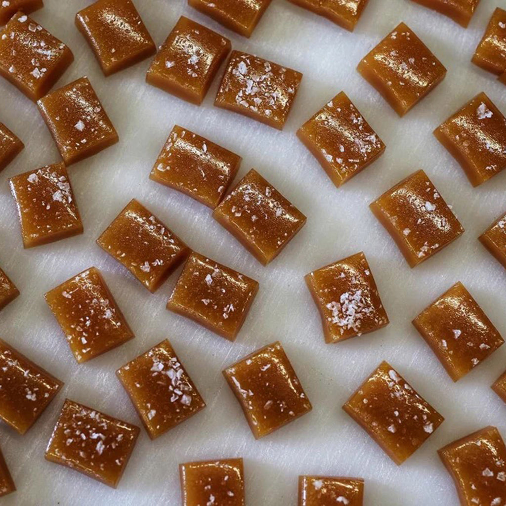 Wildflower Caramel Company Salted Caramels on white surface.