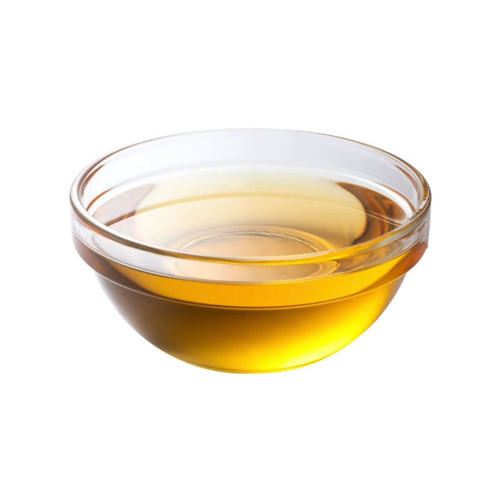 WOO World of Oils Organic Argan Oil in glass dish.