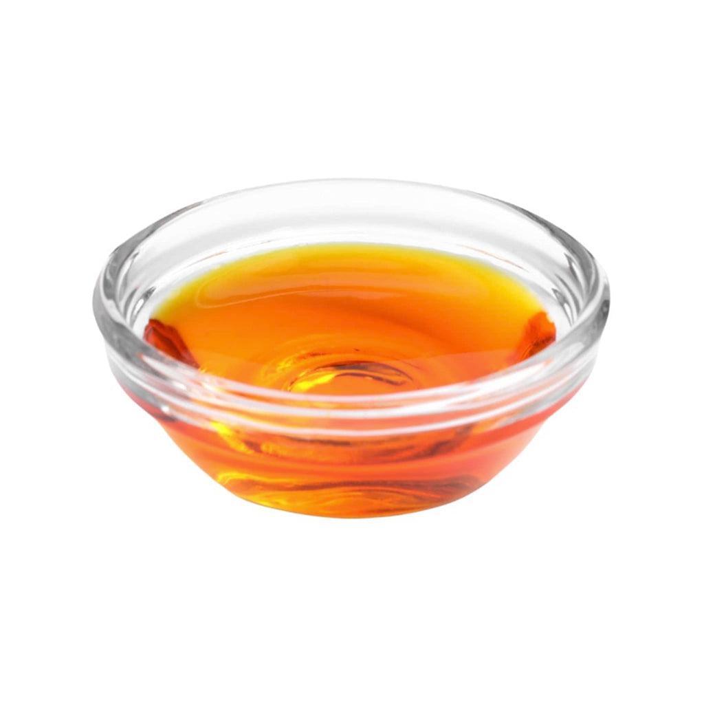 WOO World of Oils Organic Rosehip Oil in glass dish.