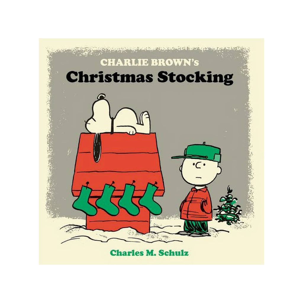Book cover of 'Charlie Brown's Christmas Stocking' featuring Snoopy and Charlie Brown with stockings hanging on the dog house.