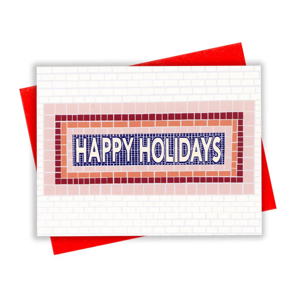Greeting card with "Happy Holidays" on subway tile background with red envelope.