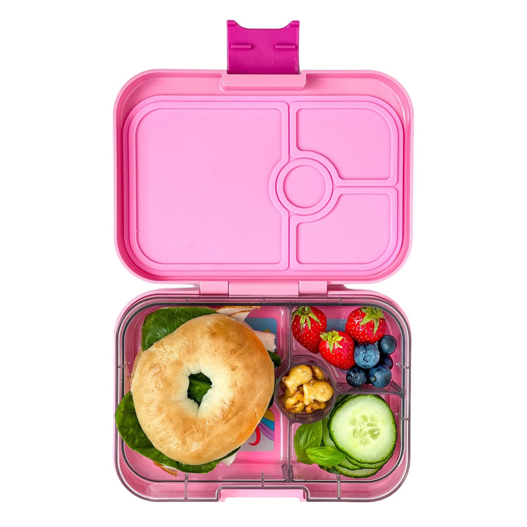 Yumbox Panino 4 compartment leakproof kids bento box in power pink case with magical unicorn illustrated tray, lid open with food inside.