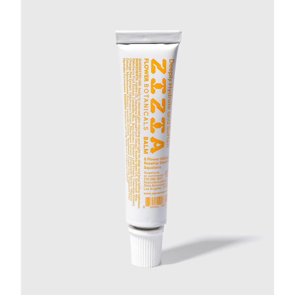 Zizia Botanicals Flower Balm Daily Face Moisturizer in white tube packaging with yellow lettering, back view.