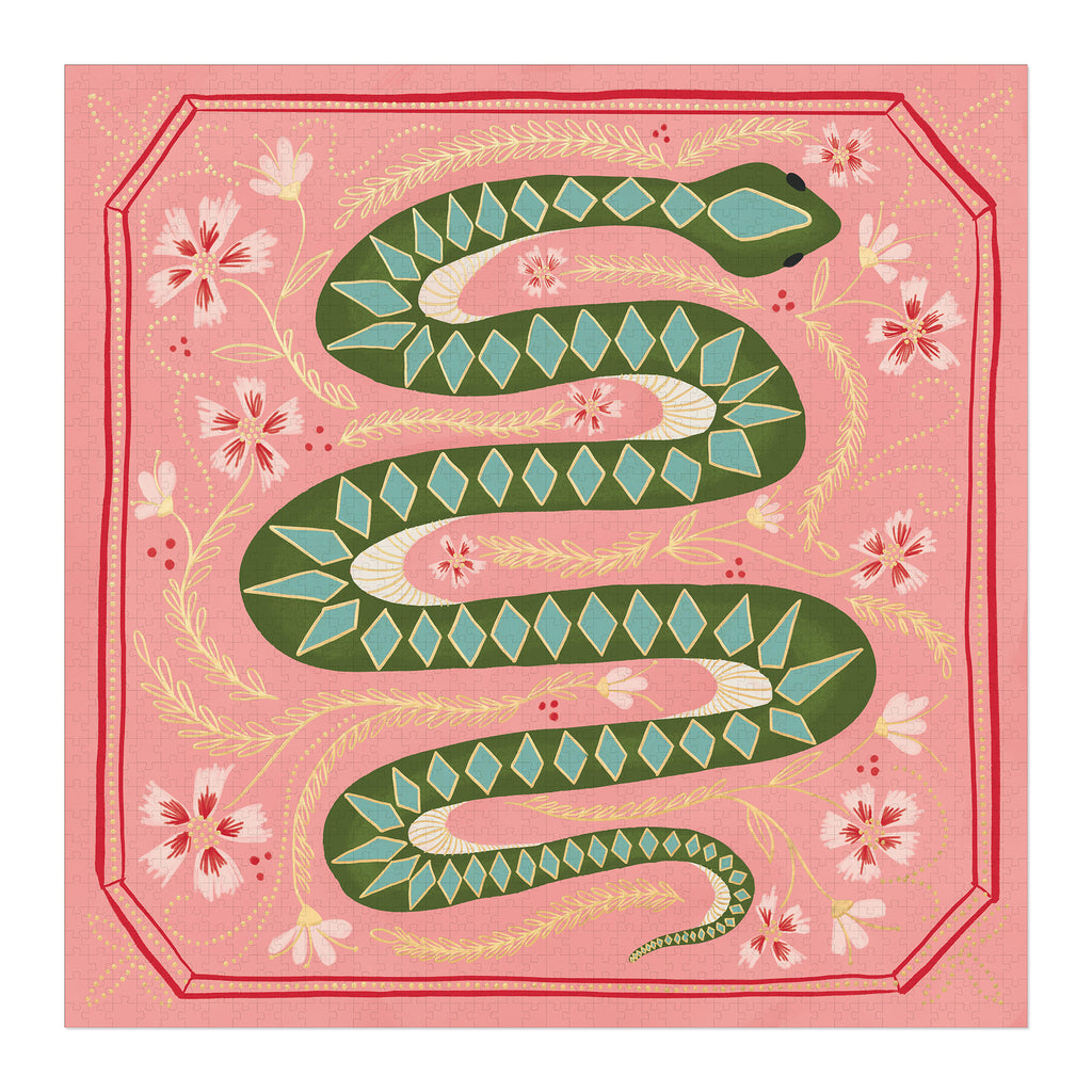 designworks ink 1000 piece mister slithers jigsaw puzzle completed of a green snake with diamond pattern on a pink background with yellow and pink and red flowers