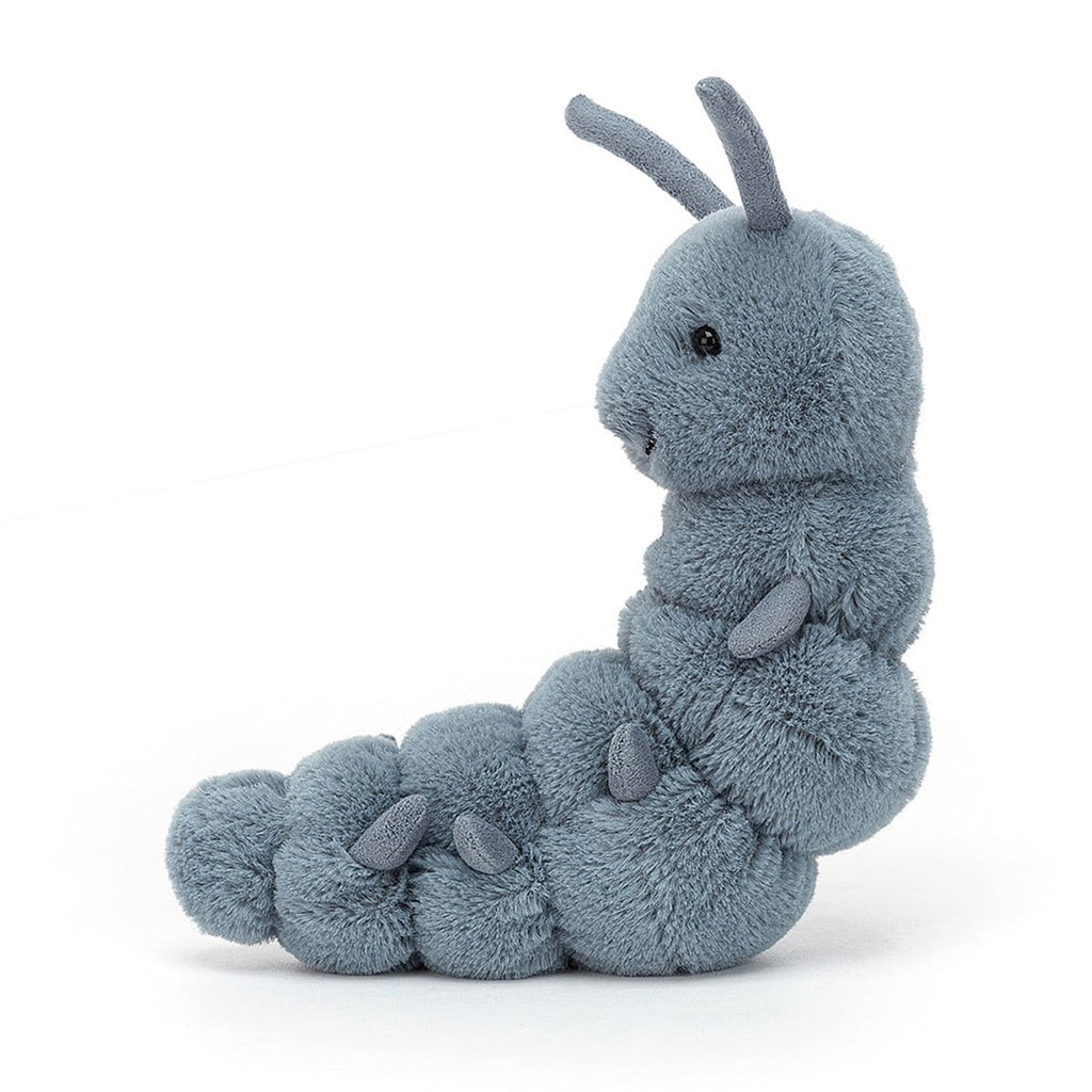 Jellycat wriggidig bug caterpillar plush toy with blue fur, black beaded eyes and suede-like antennae and legs on a segmented body, side view.