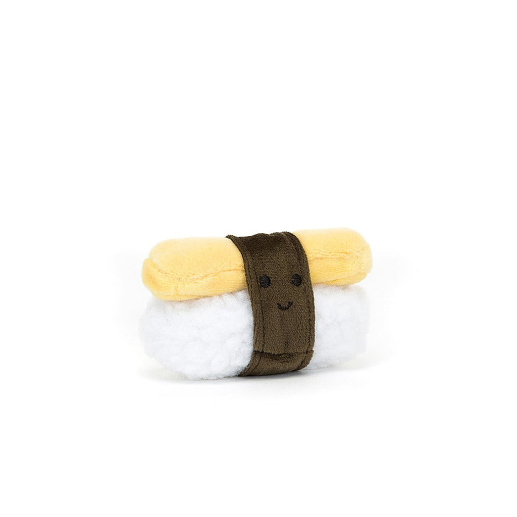 Jellycat Sassy Sushi Egg plush toy with stitched eyes and smile on the olive band of nori topping the fluffy plush "rice" and yellow "egg", front view.