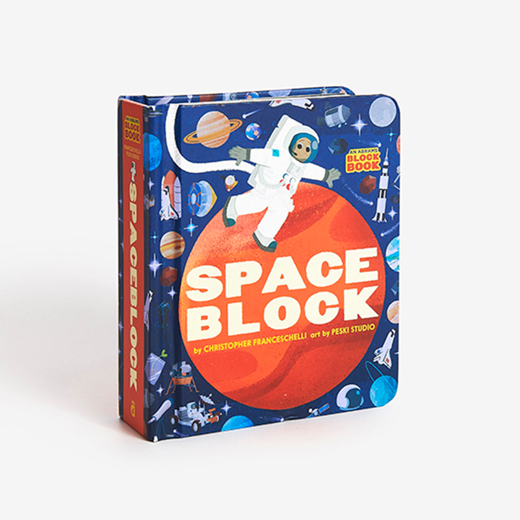 Spine and front cover of Spaceblock baby board book with an astronaut in suit walking on an orange planet with iconic space graphics all around on a dark blue background.