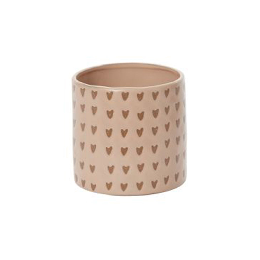 Dusty pink clay plant pot with little brown hearts all over.