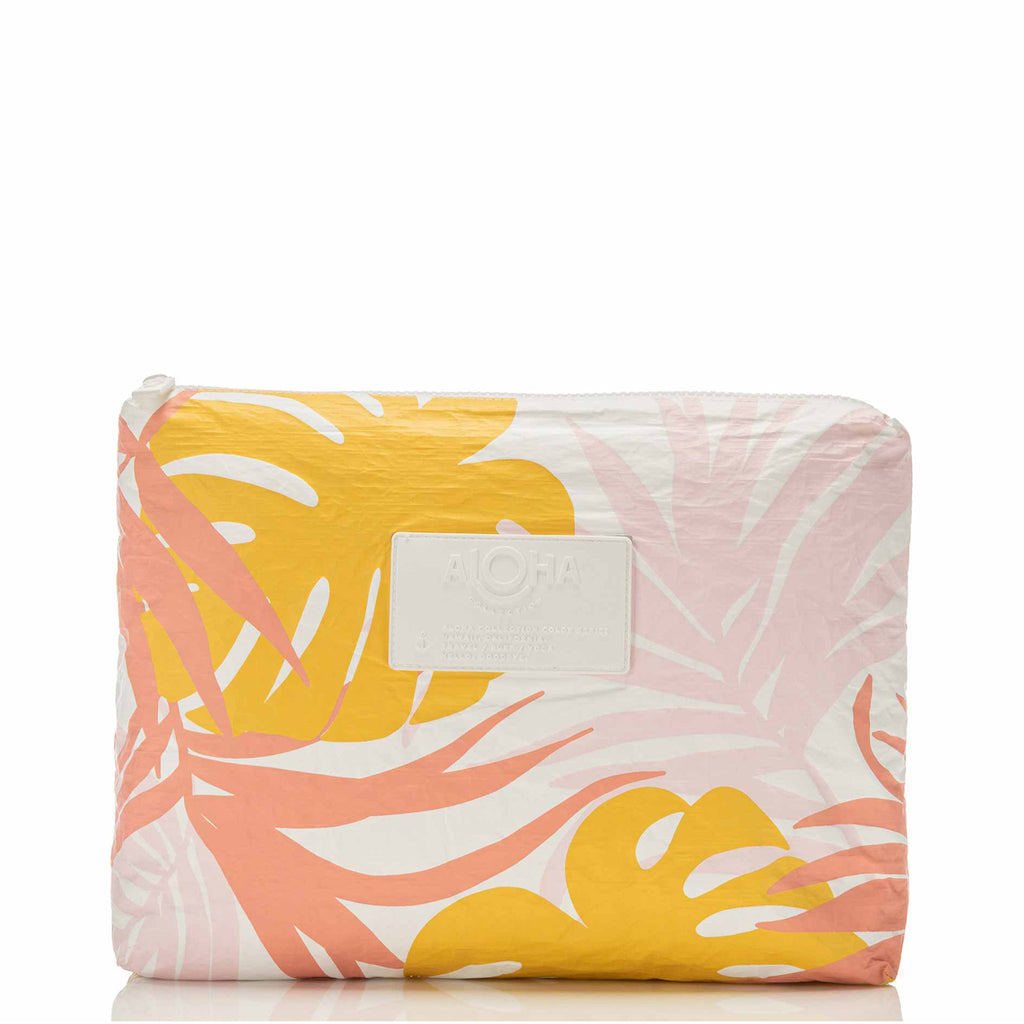 aloha collection medium waterproof pouch in tropical leaf "tropics" pattern in yellow and pink, front view with white zipper