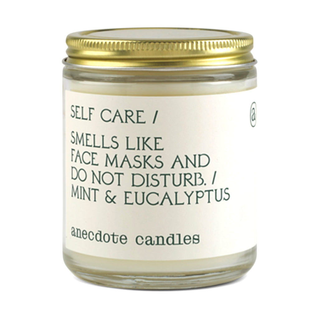 anecdote self care scented coconut soy wax candle in glass jar with gold lid