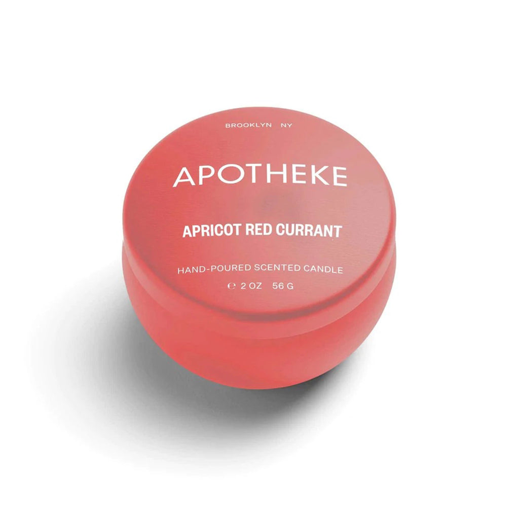 Apotheke Apricot Red Currant scented soy wax blend candle in mini orange tin with lid.