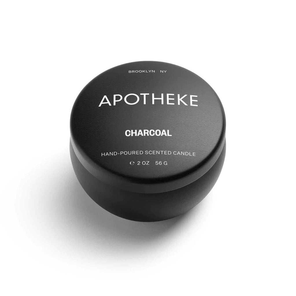 Apotheke Charcoal scented soy wax blend candle in mini black tin with lid.