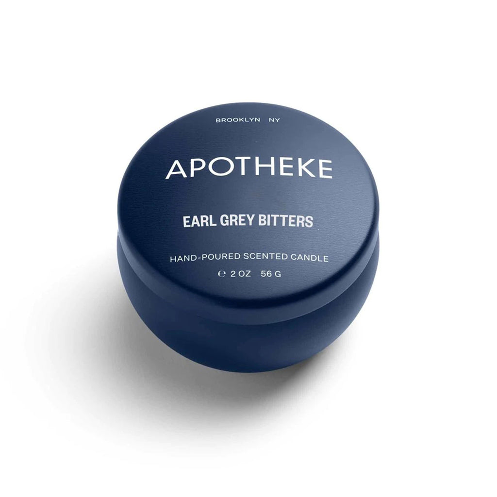Apotheke Earl Grey Bitters scented soy wax blend candle in mini navy blue tin with lid.