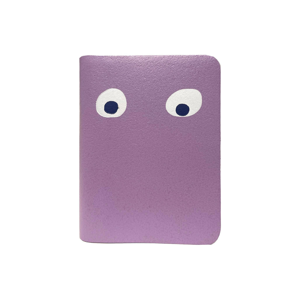 Ark Colour Design Googly Eye Mini Notebook with lilac leather cover, front view.