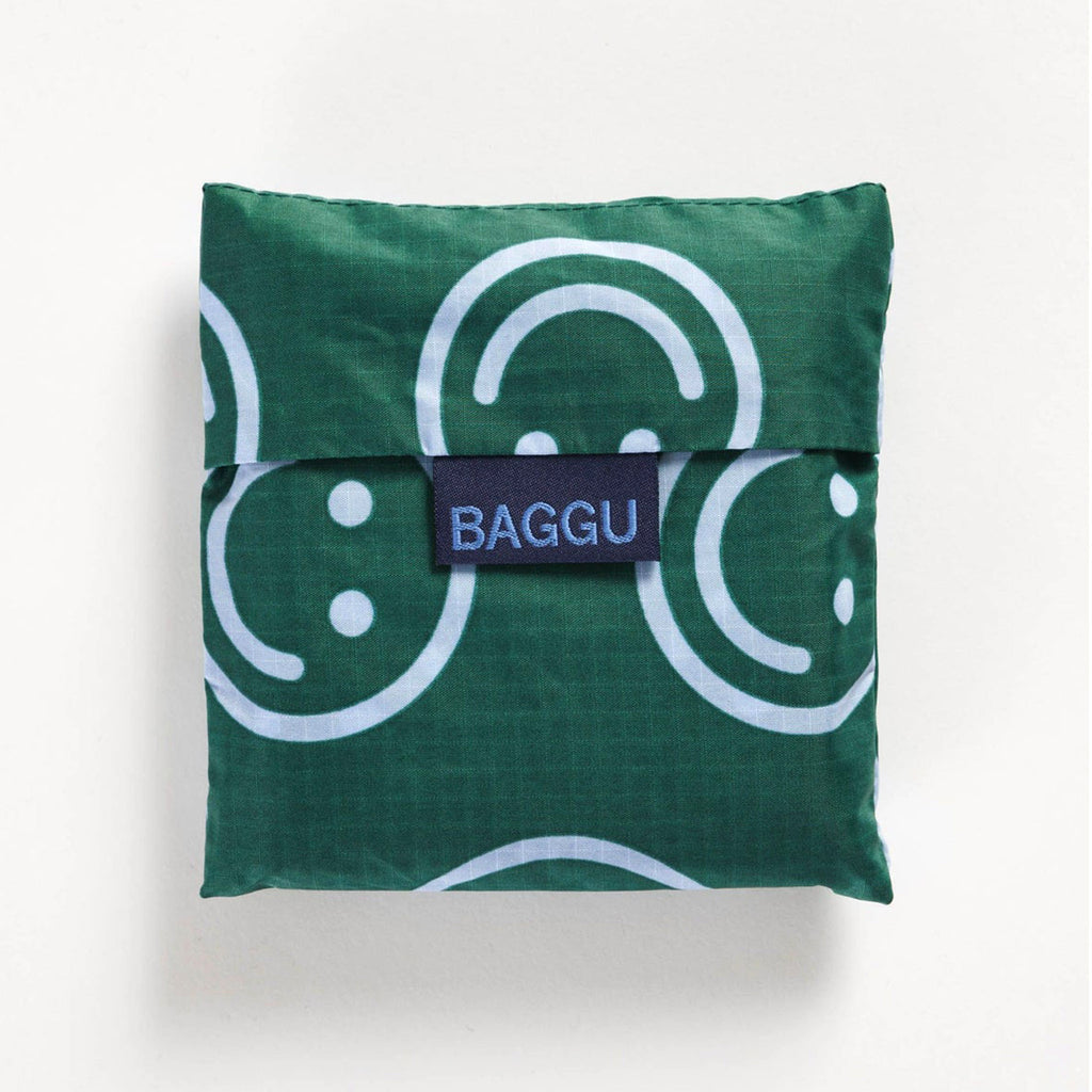 baggu standard size ripstop nylon reusable bag in forest green happy pattern in pouch