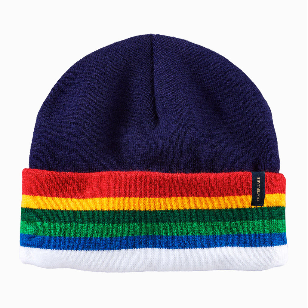 Pendleton Woolen Mills Crater Lake National Park Stripe Winter Knit Beanie Hat in navy blue with white, blue, green, dark green, yellow and red stripe on turn-back brim.