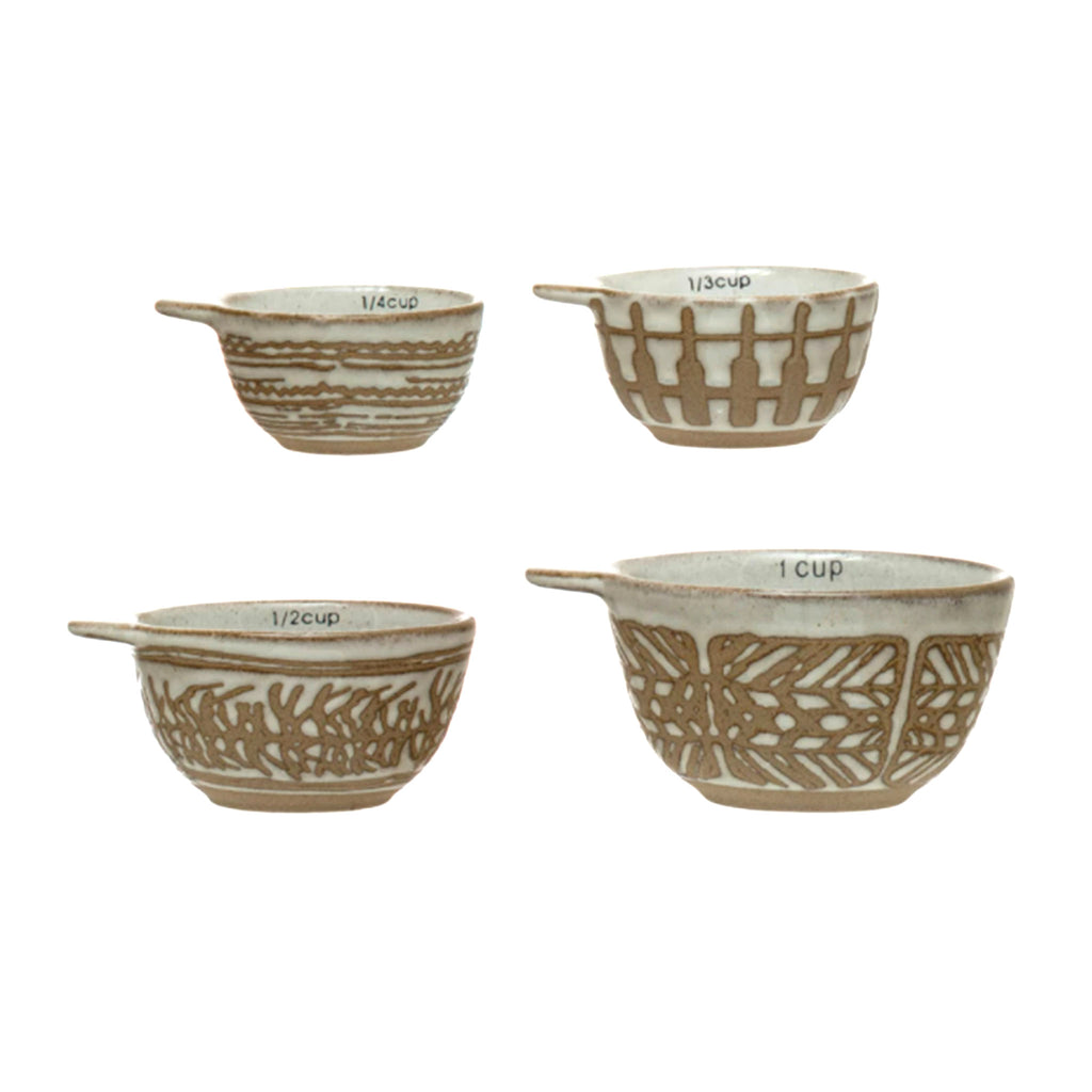 creative co-op set of four nesting stoneware measuring cups with wax relief pattern