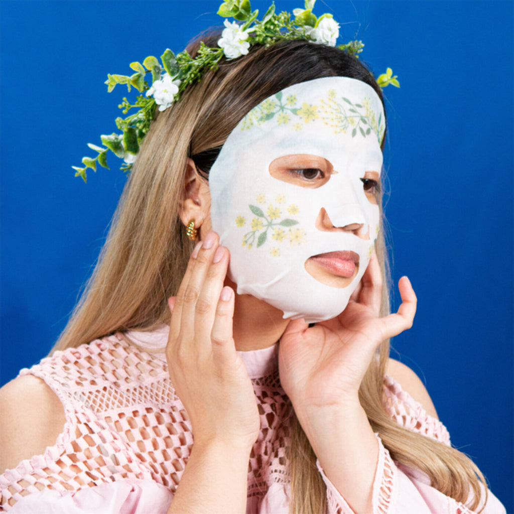 facetory dream garden elderflower rejuvenating and illuminating sheet face mask on model