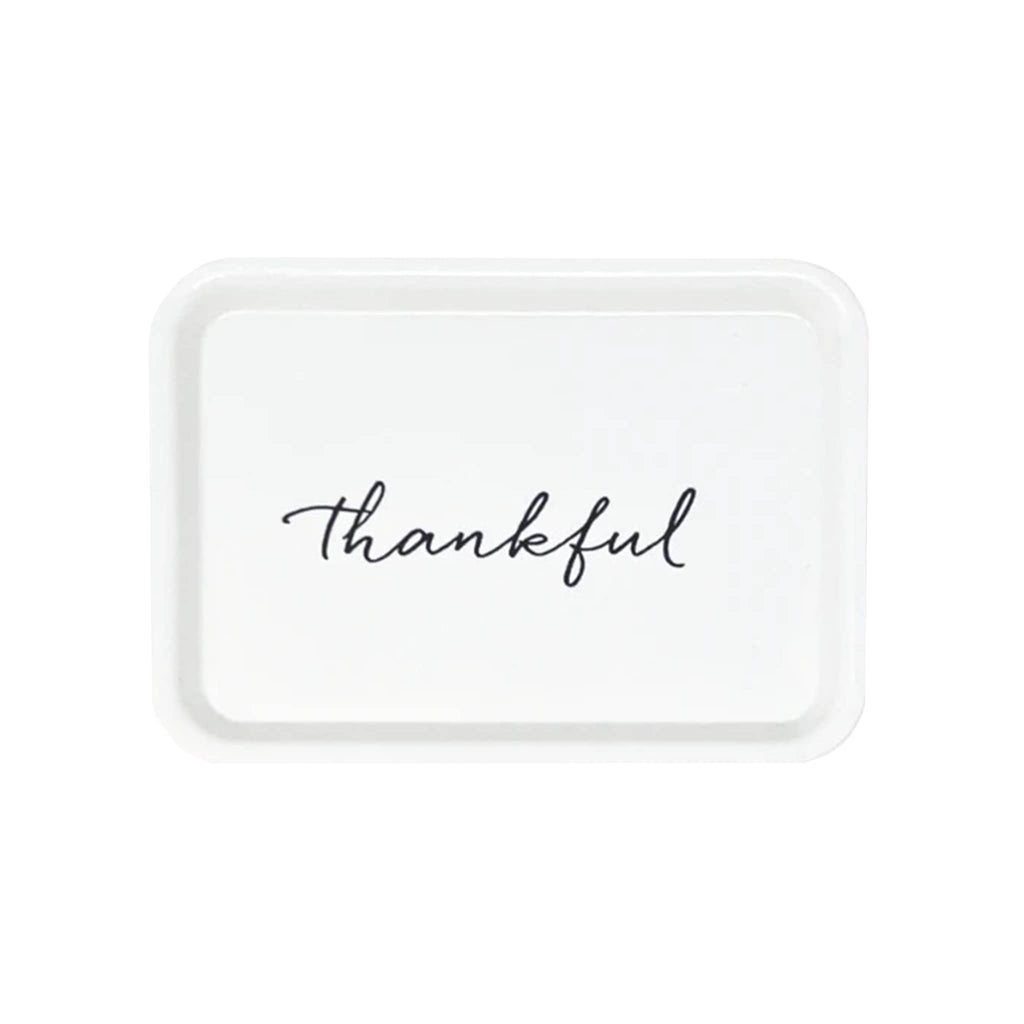 White fiberglass rectangular trinket tray with "thankful" in black script lettering.