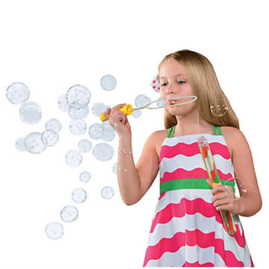 girl in pink and white wavy striped dress blowing bubbles from a yellow big bubble wand